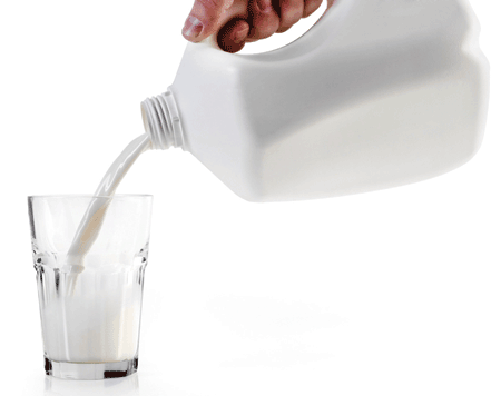 pouring gallon of milk