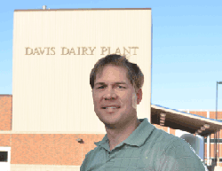 Lloyd Metzger in front of the Davis Dairy Plant
