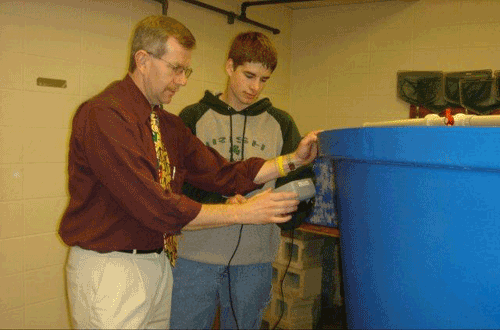 Paul Larson demonstrates aquaculture equipment
